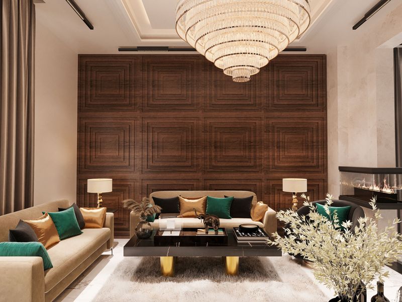 Boutique-style living room with a walnut-tone panelled wallcovering, tiered crystal chandelier, beige sofas and emerald cushions